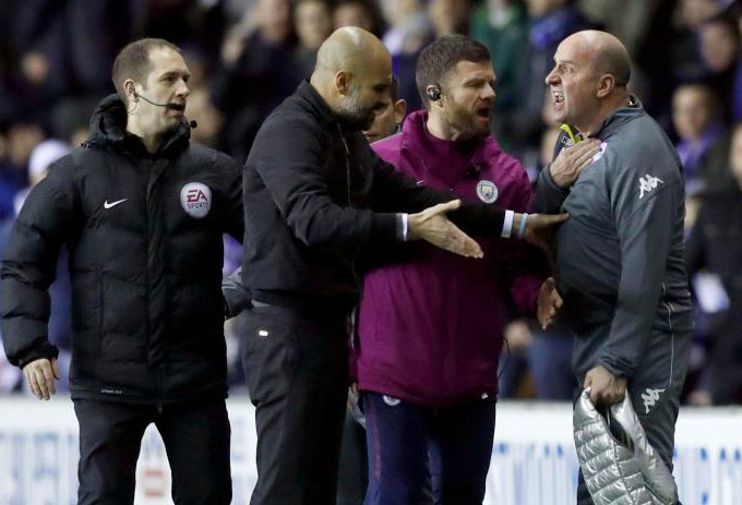 Manajer Man City, Guardiola terlibat adu mulut dengan Manajer Wigan, Paul Cook. (Foto;gettyimages)