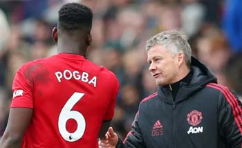 Manajer Ole Gunnar Solksjaer dan Paul Pogba. (Foto"90Min)