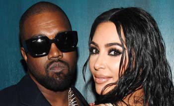 Kanye West dan istrinya Kim Kardashian. (Foto:Billboard)