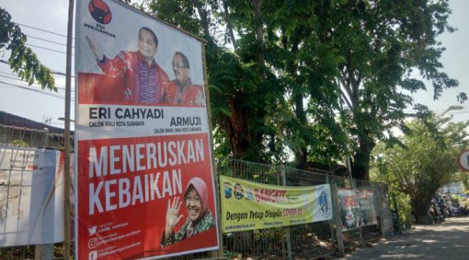 APK Eri-Armuji bersama Risma terpampang di jalanan Surabaya. (Foto: Istimewa)