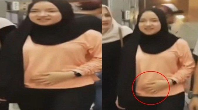 Perempuan mirip Nissa Sabyan tampak mengelus perut buncitnya. Ia diduga hamil. (Foto: Tangkapan layar)