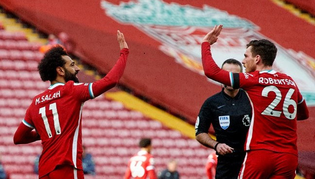 Dua pemain Liverpool Mohamed Salah dan Andrew Robertson berkontribusi penting dalam kemenangan Liverpool atas Aston Villa. (Foto: Twitter/@LFC) 