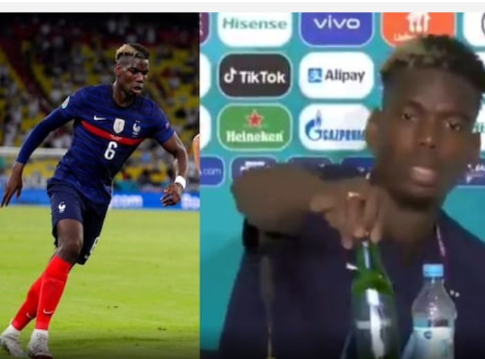 Paul Pogba menyingkirkan bir Heineken dari meja konferensi pers di Euro 2020. (Foto: news18)