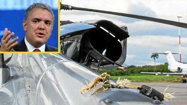 Sobek bekas tembakan di badan helikopter yang ditumpangi Presiden Kolombia Ivan Duque. Helikopter itu ditembak dari bawah dekat perbatasan dengan Venezuela, hari Jumat lalu. Inzet; Presiden Kolombia Ivan Duque. (Foto:Reuters)