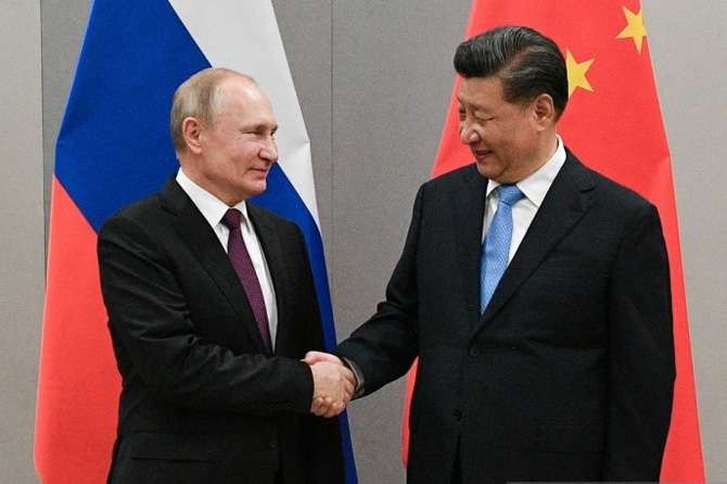 Presiden Rusia Vladimir Putin (kiri) bersama Presiden China Xi Jinping (kanan). (Foto: Reuters)