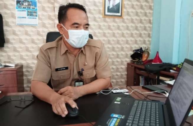 Kepala Dinas Kominfo dan Persandian Situbondo yang jugs Wakil Ketua Satgas Covid-19 setempat  Dadang Aries Bintoro. (foto: guido/ngopinareng.id)