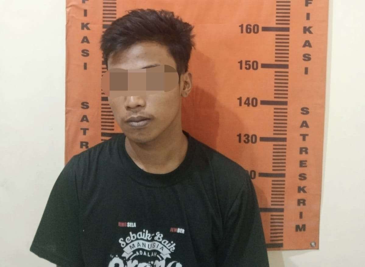 Tersangka HN ditahan di Polsek Rambipuji (Foto: Istimewa)