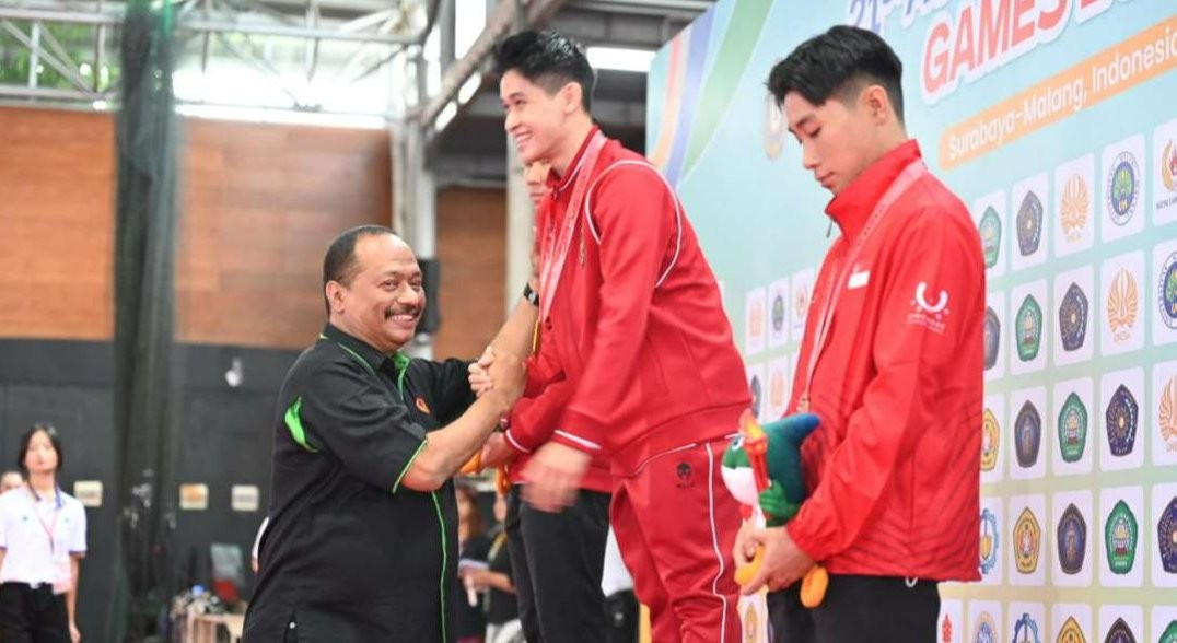 Ketua KONI Jatim M. Nabil mengapresiasi Ubaya yang telah memfasilitasi atlet wushu Jatim hingga menorehkan prestasi gemilang di AUG 2024. (Foto: KONI Jatim).