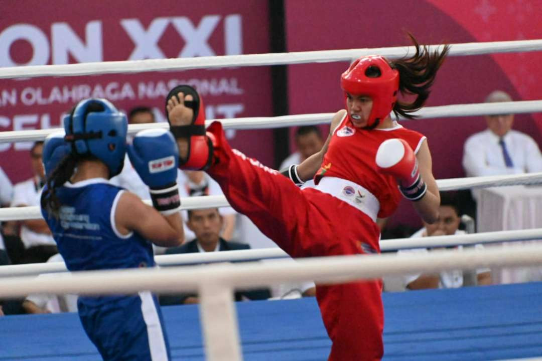 Viona sumbang emas pertama untuk Jatim di cabor kickboxing. (Foto: KONI Jatim)